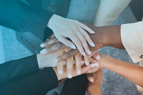 Businesspeople stacking hands over each other 150243629 copy